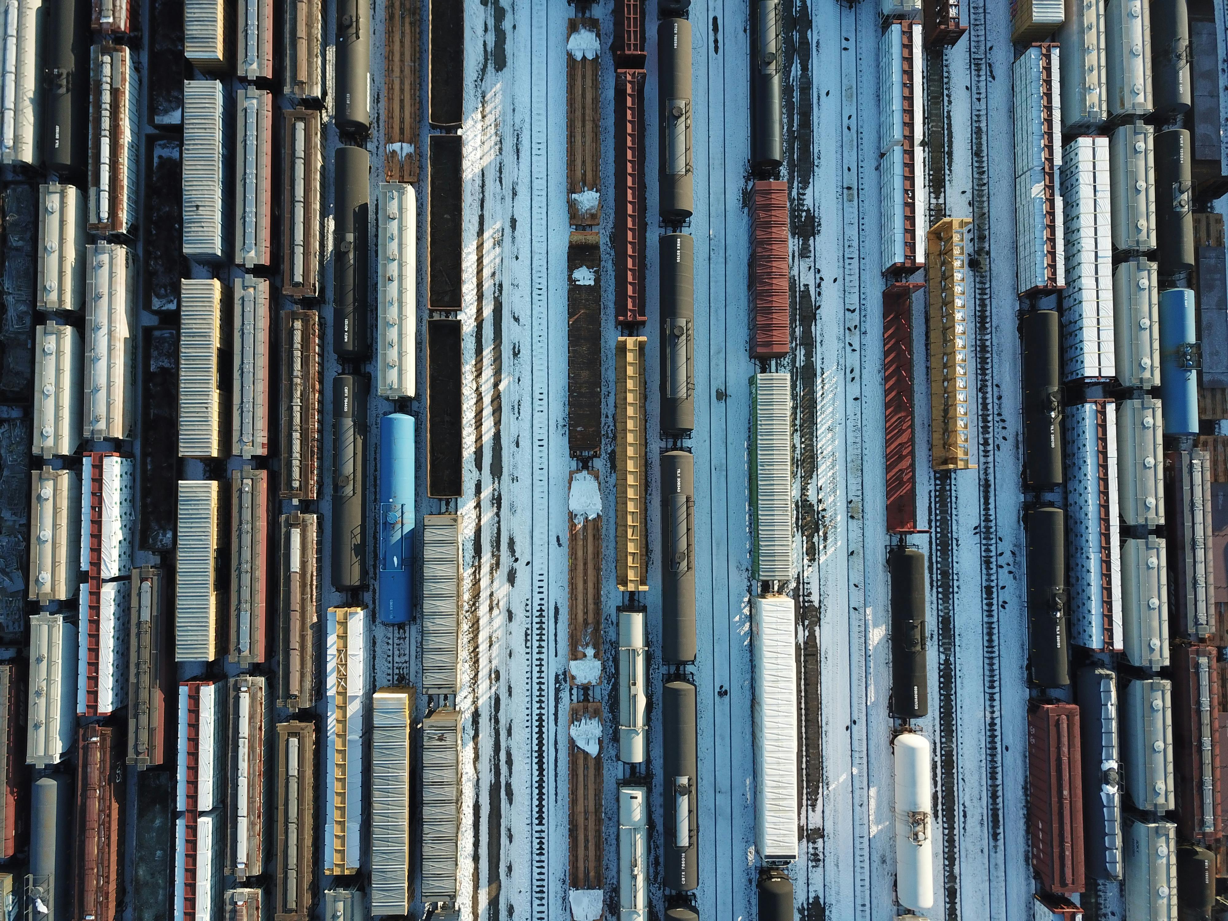 Aerial view of freight rail cars in a yard
